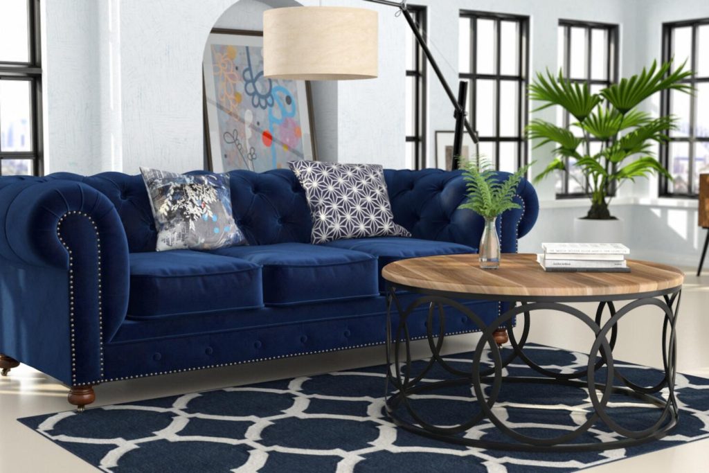 3D interior render of a bright loft living room with a navy chesterfield sofa