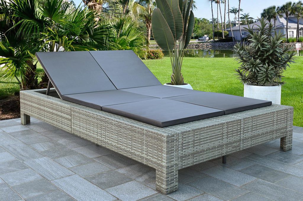 3D render of a rattan outdoor daybed on a patio